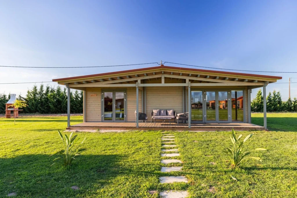 Wide view of big cabin with covered decking area